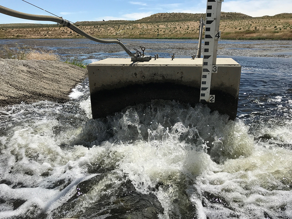 Recycled water flows into a percolation pond